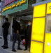  Palestinian Authority public servants wait to receive their salaries via an automated teller machine (ATM) outside a bank, in Tubas in the West Bank December 3, 2020. 