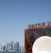 A Qatar 2022 logo is seen in front of the skyline of the West Bay in Doha ahead of the FIFA World Cup, November 10, 2022.