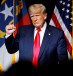 Former US President Donald Trump makes a fist while reacting to applause after speaking at the North Carolina GOP convention dinner in Greenville, North Carolina, US June 5, 2021. 