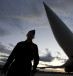 A Russian officer stands in front of a TU-160 bomber, or Blackjack, at a military airbase in Engels, some 900 km (559 miles) south of Moscow, August 7, 2008.
