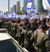  A line of Border Police officers holds back protestors in Tel Aviv.