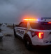 A police car blocks the entrance to the Inlet State Park before the expected arrival of Hurricane Nicole in Fort Pierce, Florida, US November 9, 2022.