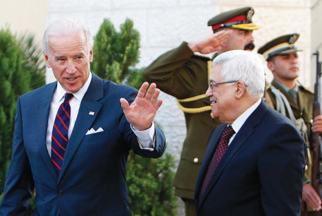 THEN-US vice president Joe Biden gestures as he walks with Palestinian Authority President Mahmoud Abbas after their meeting in Ramallah in 2010.