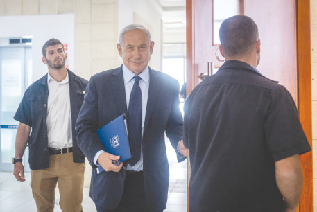  WILL HE keep smiling? Former prime minister Benjamin Netanyahu arrives for a court hearing last week.