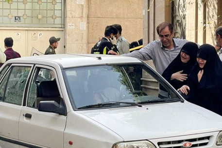  Family members of Colonel Sayad Khodai, a member of Iran's Islamic Revolution Guards Corps, weep over his body in his car after he was reportedly shot by two assailants in Tehran, Iran, May 22, 2022.