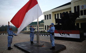 PARTICIPANTS RAISE an Indonesian flag at a training center in Rumpin, Indonesia, last June.