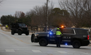 Law enforcement vehicles are seen in the area where a man has reportedly taken people hostage at a synagogue during services that were being streamed live, in Colleyville, Texas, US, January 15, 2022.