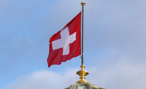 The flag of Switzerland flies on the dome of the Parliament Building (Bundeshaus), as the spread of the coronavirus disease (COVID-19) continues, in Bern, Switzerland, October 28, 2020.