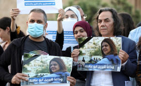  Lebanese journalists hold pictures of Al Jazeera reporter Shireen Abu Akleh, who was killed during a live fire exchange between Palestinians and IDF in Jenin, to express solidarity, in front of the UN building in Beirut, Lebanon May 11, 2022. 