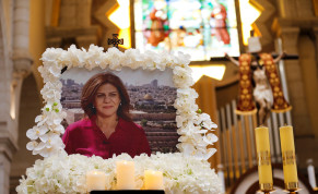  A portrait of Al Jazeera journalist Shireen Abu Akleh, who was killed during an Israeli raid, is displayed during a special mass in her memory in the Church of the Nativity in Bethlehem in the West Bank, May 16, 2022. 
