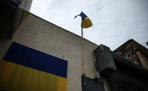  The flag of Ukraine hangs and flies, as the Russian invasion of Ukraine continues, outside a shop near the service road of the Major Deegan Expressway in the Bronx borough of New York City, US, May 16, 2022. 