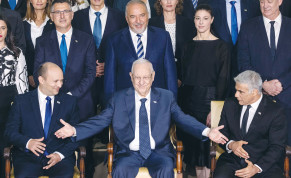  THEN-PRESIDENT Reuven Rivlin is flanked in the front row by Prime Minister Naftali Bennett and Foreign Minister Yair Lapid for a group photo of the newly inaugurated government last June. 