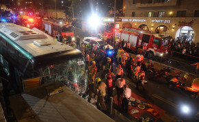  Police and rescue personnel at the scene of where a bus lost control and plowed into a store in central Jerusalem, killing at least two people. August 11, 2022. 