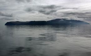  The island of Big Diomede sits in the morning mist on the Russian side of the Bering Strait as seen from the Russian research vessel Professor Khromov August 28, 2009. 