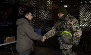  Ukraine's President Volodymyr Zelensky awards a service member at a position near a frontline on the Day of the Ukrainian Armed Forces, amid Russia's attack on Ukraine, in Donetsk region, Ukraine December 6, 2022.