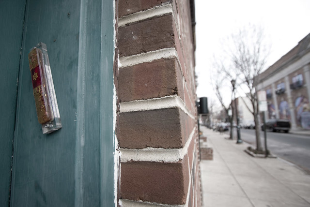Mezuzah affixed to a door frame on South Street in Philadelphia. (photo credit: Wikimedia Commons)