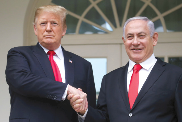 US PRESIDENT Donald Trump shakes hands with Prime Minister Benjamin Netanyahu as they pose in the Rose Garden at the White House this week (photo credit: REUTERS/LEAH MILLIS)
