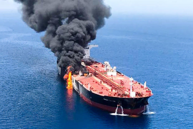 An oil tanker is seen after it was attacked at the Gulf of Oman, June 13, 2019 (photo credit: ISNA/REUTERS)