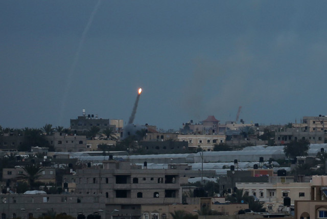 A rocket is fired towards Israel, in the southern Gaza Strip February 24, 2020 (photo credit: REUTERS/IBRAHEEM ABU MUSTAFA)