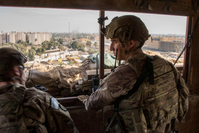 US Army soldiers keep watch on the US embassy compound in Baghdad, Iraq January 1, 2020 (photo credit: DOD/LT. COL. ADRIAN WEALE/HANDOUT VIA REUTERS)