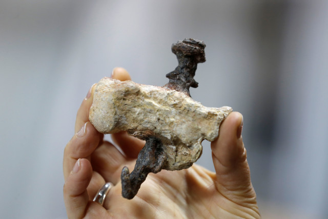 A replica of a find from Jerusalem, shows a heel bone pierced with an iron nail, believed to be the bone of Yehohanan Ben Hagkol, during a media tour presenting significant findings from that time, at Israel's National Treasures Storeroom, in Beit Shemesh. (photo credit: REUTERS)