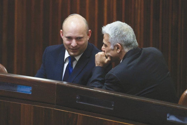 NAFTALI BENNETT consults with Yair Lapid in the Knesset last week. (photo credit: RONEN ZVULUN/REUTERS)