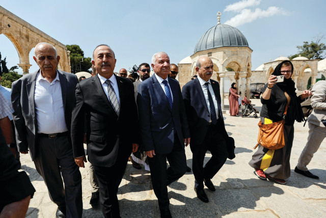  TURKISH FOREIGN Minister Mevlut Cavusoglu visits the compound that houses Al-Aqsa Mosque in Jerusalem’s Old City, Wednesday.  (photo credit: AMMAR AWAD/REUTERS)