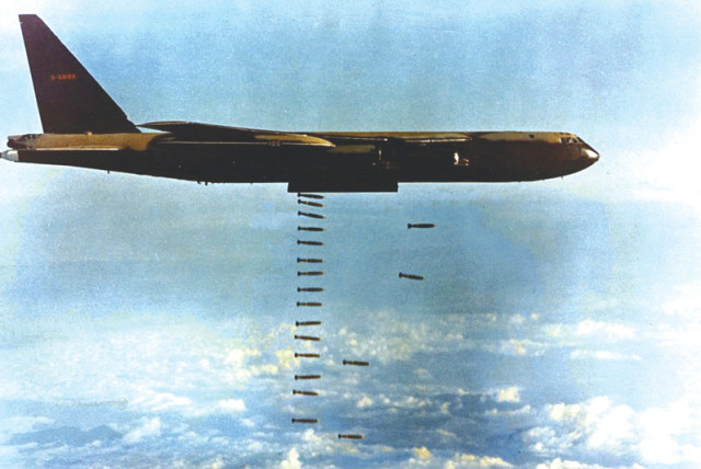  A US Air Force Boeing B-52 drops bombs during the Vietnam War.  (photo credit: Wikimedia Commons)