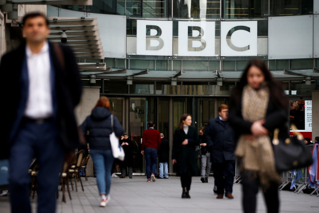 Pedestrians walk past a BBC logo at Broadcasting House in London, Britain, January 29, 2020.
