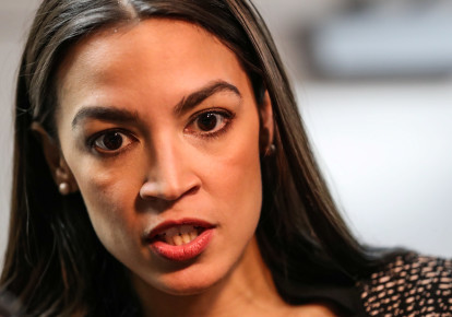 U.S. Representative Alexandria Ocasio-Cortez (D-NY) speaks to reporters after finishing a televised town hall event on the “Green New Deal” in the Bronx borough of New York City, New York, U.S., March 29, 2019 (photo credit: JEENAH MOON/REUTERS)