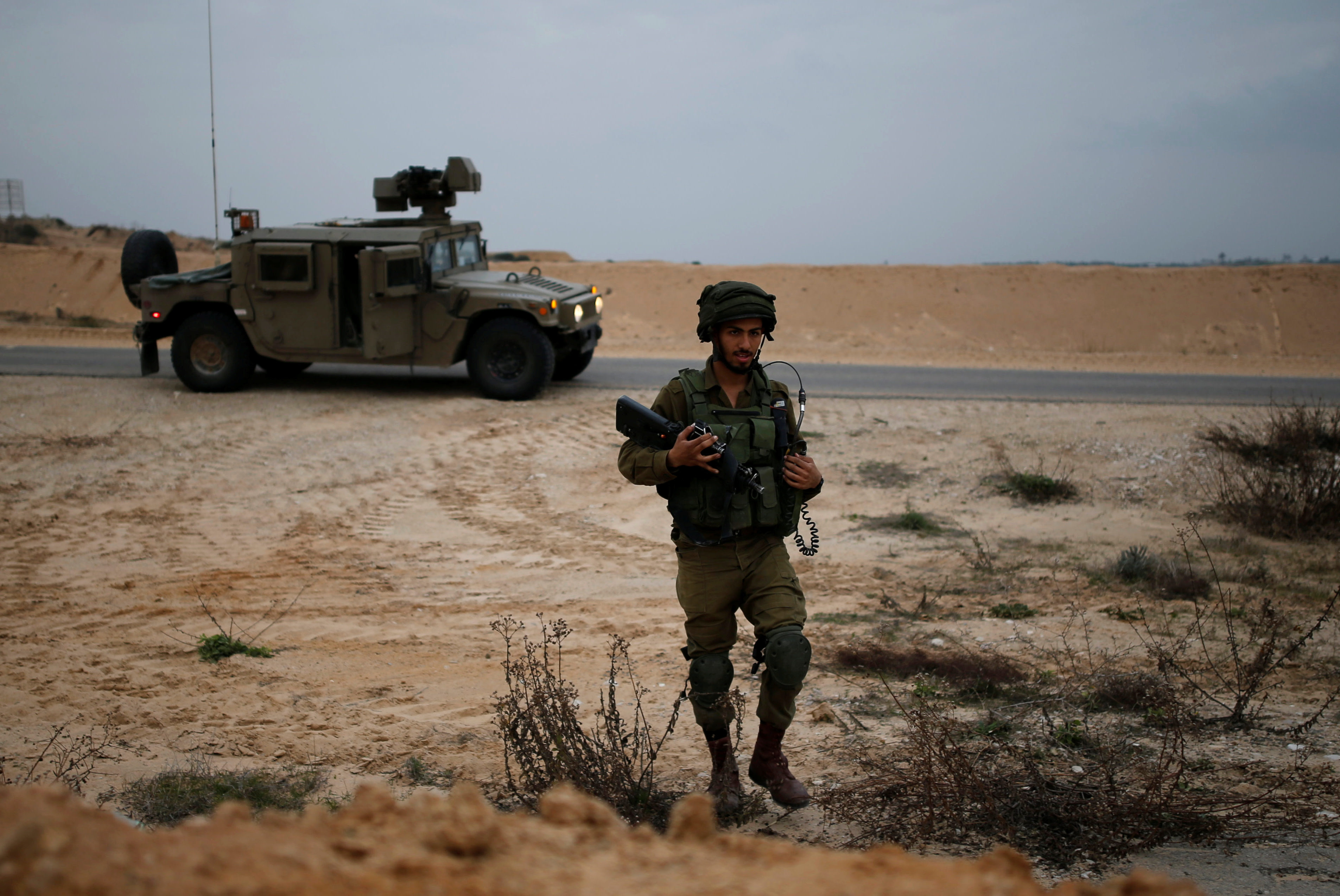 An Israeli soldier patrols the Israeli side of the Israel-Gaza border January 25, 2017. (Reuters/Amir Cohen)