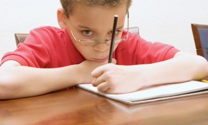 Boy reluctant to do his homework Thinkstock/Imagebank