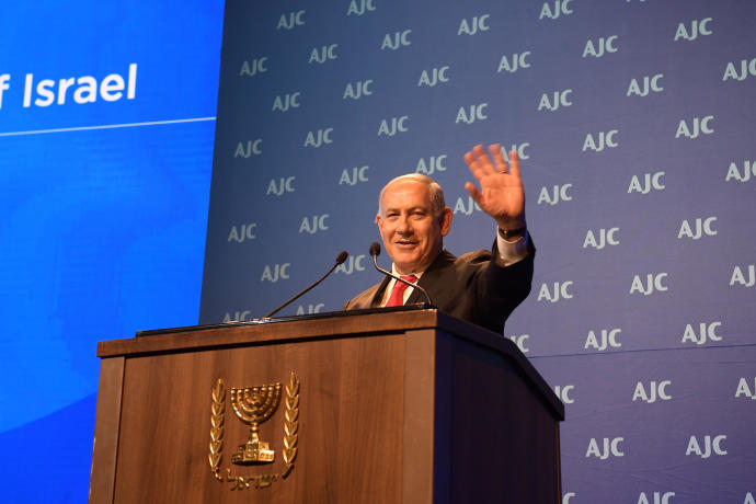 Prime Minister Benjamin Netanyahu addresses the AJC Global Forum, June 10, 2018AMOS BEN GERSHOM, GPO
