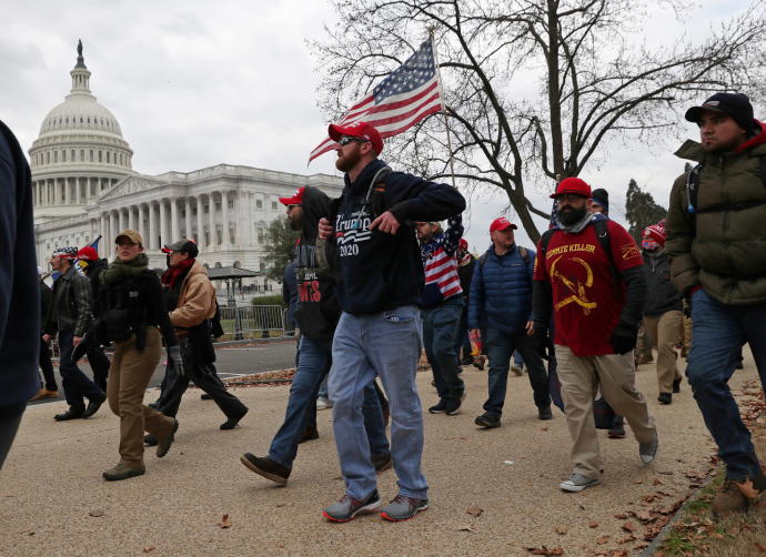Members of the Proud Boys and supporters of US President Donald Trump show up at the US Capitol Building over an hour before supporters began to storm the building in Washington, US, January 6, 2021.REUTERS/LEAH MILLIS