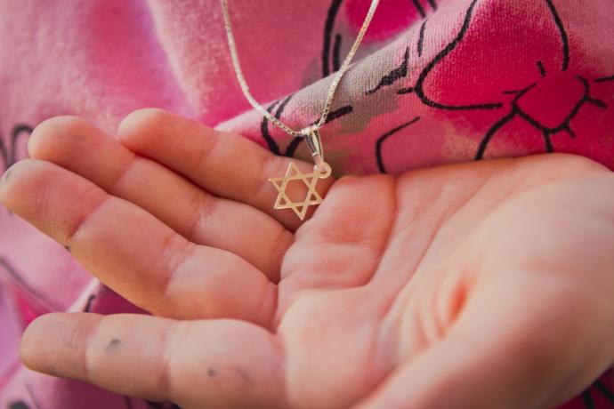 Jewish star necklaces are a signifier of Jewish identity and, some fear, a potential risk during times of antisemitism.GETTY IMAGES/JTA
