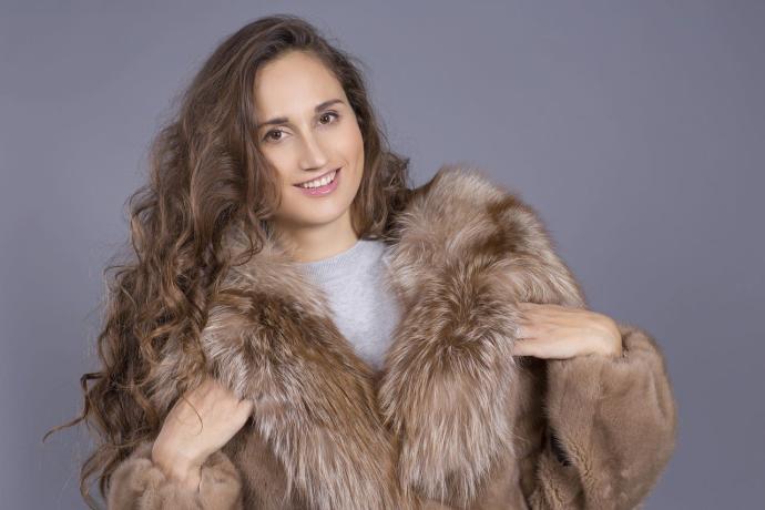  A woman is seen wearing a fur coat.PIXABAY