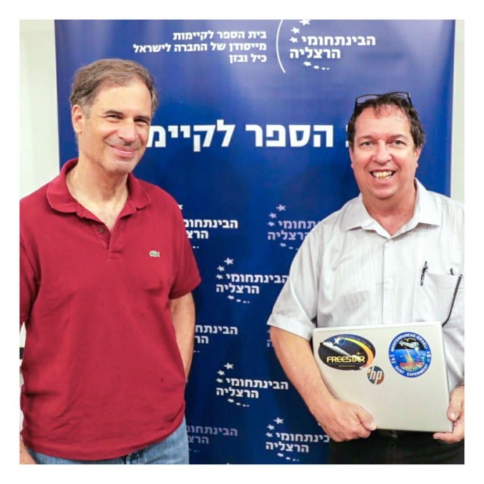 Israeli astronaut Eitan Stibbe and researcher and dean of the School of Sustainability, Prof. Yoav Yair. (Elad Malka)