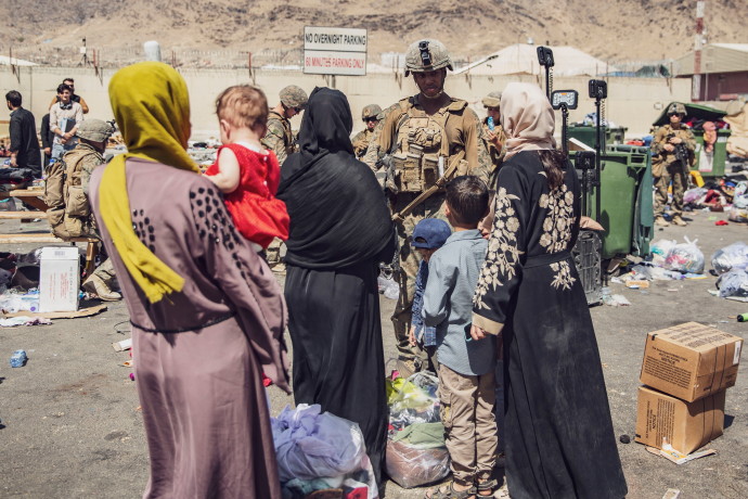 US Marines with the 24th Marine Expeditionary Unit (MEU) process evacuees as they go through the Evacuation Control Center (ECC) during an evacuation at Hamid Karzai International Airport, Kabul, Afghanistan, August 28, 2021 (SGT. VICTOR MANCILLA/US MARINE CORPS/HANDOUT VIA REUTERS).