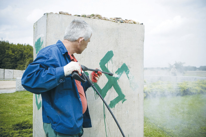A PRESSURE hose is used to clean a monument with Nazi swastikas painted over it in Jedwabne, Poland, in this 2011 illustrative photoJendrzej Wojnar/Agencja Gazeta/Reuters