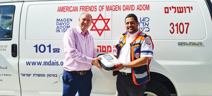 MAGEN FUND co-founder David Rose (left) with MDA paramedic Ariel MatlonCOURTESY OF THE MAGEN FUND