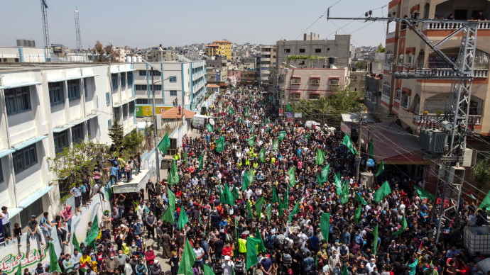 A picture taken with a drone shows Hamas supporters taking part in a protest against Palestinian President Mahmoud Abbas' decision to postpone planned parliamentary elections, in the northern Gaza Strip April 30, 2021.REUTERS/MOHAMMED SALEM