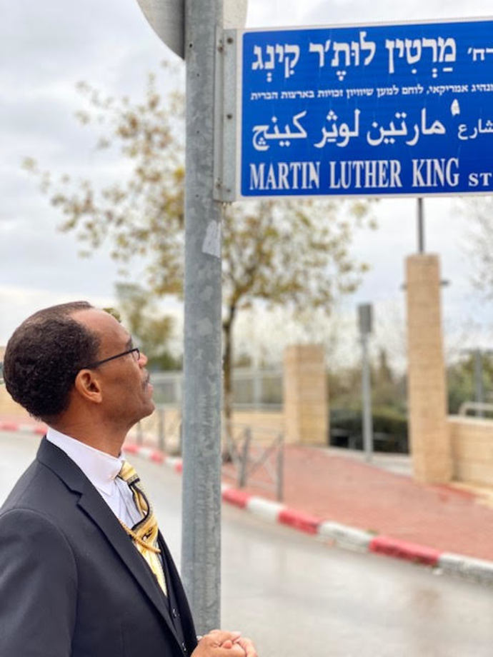 Bishop Plummer in front of Martin Luther King St. in Jerusalem. (Credit: Courtesy of the Church of God in Christ (COGIC))