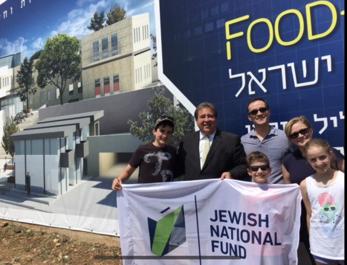 The Zusman family, pictured with JNF-USA CEO Russell F. Robinson, outside the Margalit Startup City Galil (Credit: COURTESY/JNF-USA)