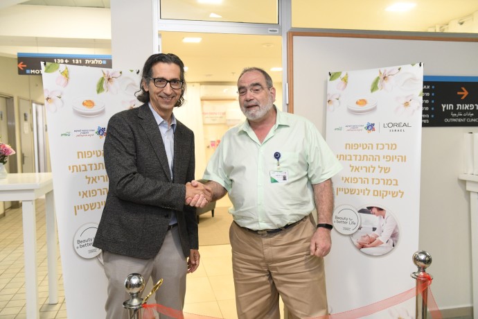 Dr. Chagai Amir, the Loewenstein Rehabilitation Hospital with Eli Sagiv L'Oreal's CEO (Credit: Gadi Sierra)