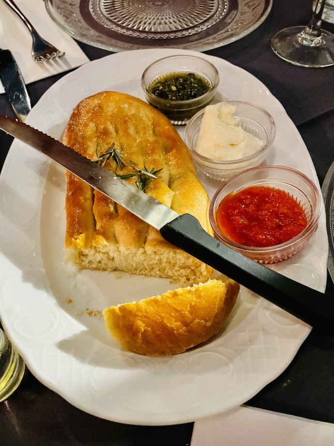 Bread with dips —one with hyssop (ezov, za’atar) — at The Eucalyptus restaurant (Credit: ELIANA RUDEE)