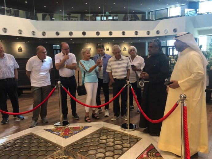 Father Saji Thomas gives a tour of the Cathedral of Our Lady of Arabia to an Evangelical delegation led by Joel C. Rosenberg (Credit: Courtesy / ALL ARAB NEWS)