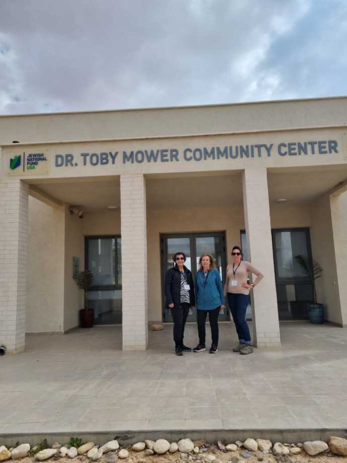 Eileen Lash; Jewish National Fund-USA Women for Israel President, Barbara Burry; and Julia Rymer Brucker in front of the Dr. Toby Mower community center in Zuqim (Credit: JNF-USA)