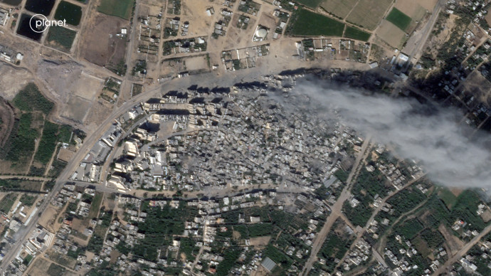 Satellite view of smoke over heavily damaged areas from Israeli strikes in the Palestinian city of Beit Hanoun, northern Gaza Strip, October 15, 2023 in this handout image Planet Labs PBC/Handout via REUTERS