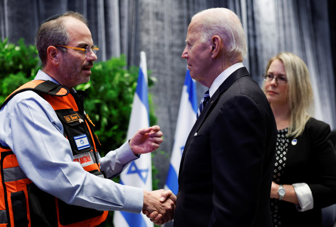 U.S. President Joe Biden shakes hands with Eli Beer, during a meeting with Israeli first responders, family members and other citizens directly impacted by the October 7th attack on Israel by Hamas, in Tel Aviv, Israel, October 18, 2023. (Credit: REUTERS/EVELYN HOCKSTEIN)