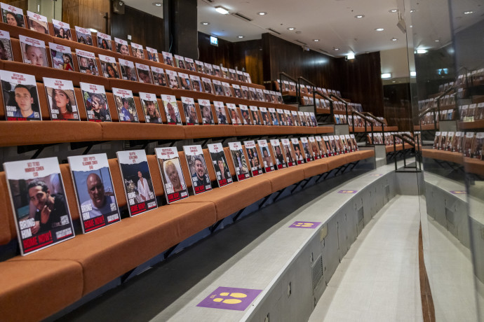 Photos of the Gaza hostages adorn the Knesset plenum, November 7, 2023 (NOAM MOSKOVITZ/KNESSET)